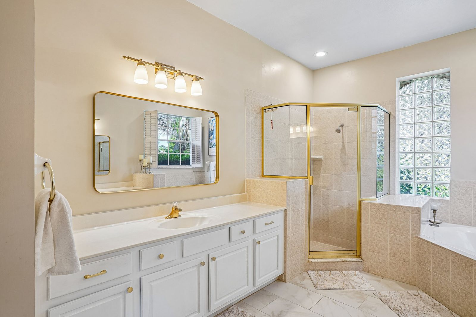 Primary bathroom vanity and shower