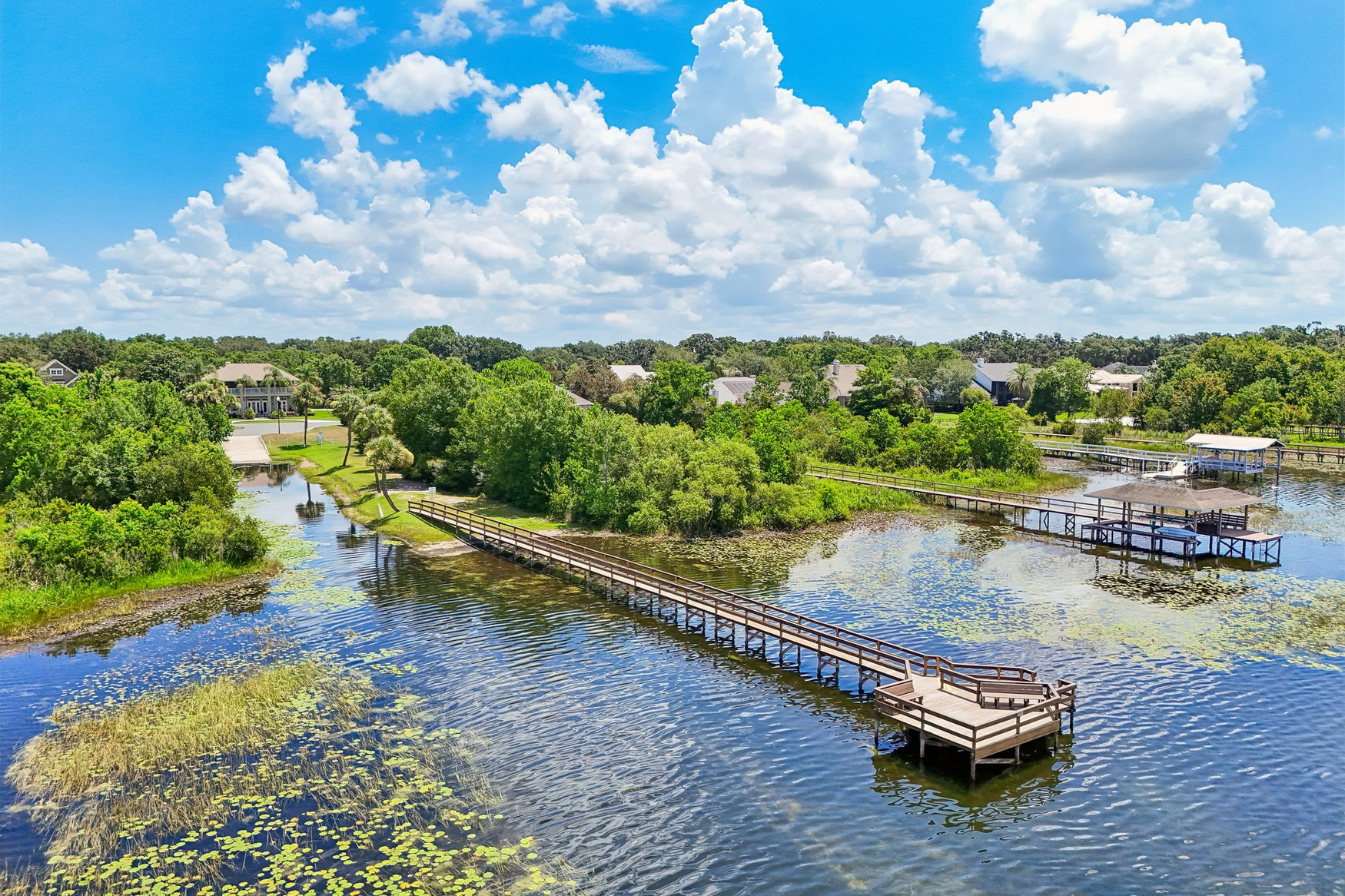 Aerial view of Park Place community fishing pier reaching into Lake Joanna